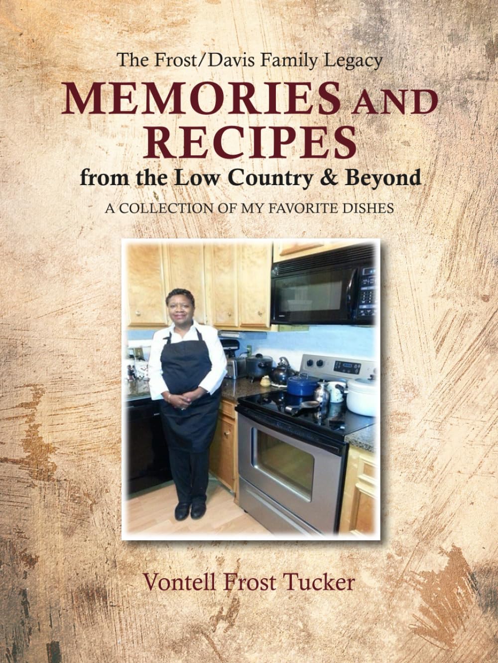 Book cover titled MEMORIES AND RECIPES from the Low Country & Beyond by Vontell Frost Tucker, featuring a woman in a kitchen wearing a black apron, standing by a stove with pots and dishes.