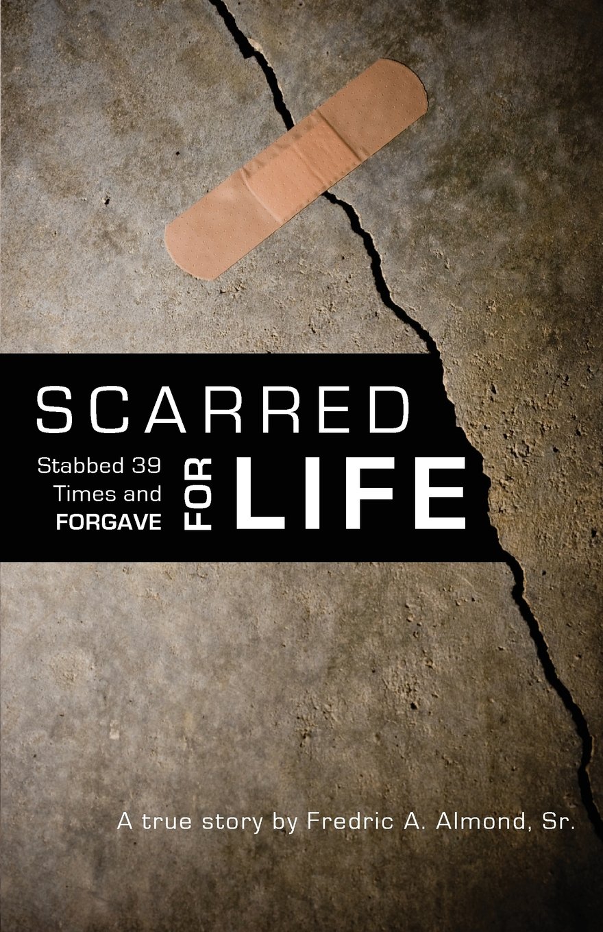Book cover with a cracked concrete background, a bandage at the top, and the title Scarred for Life: Stabbed 39 Times and Forgave by Fredric A. Almond, Sr. at the bottom.